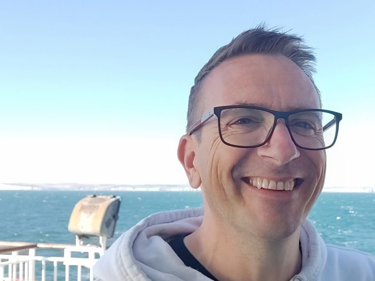 Gavin Kyle Gavin with a sea view in the background.